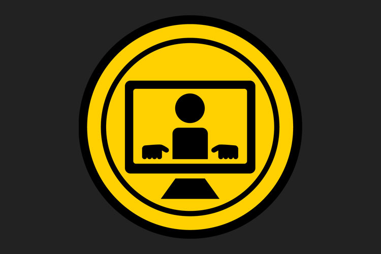 Small yellow and black icon on dark gray background showing a simplified person working at a computer.